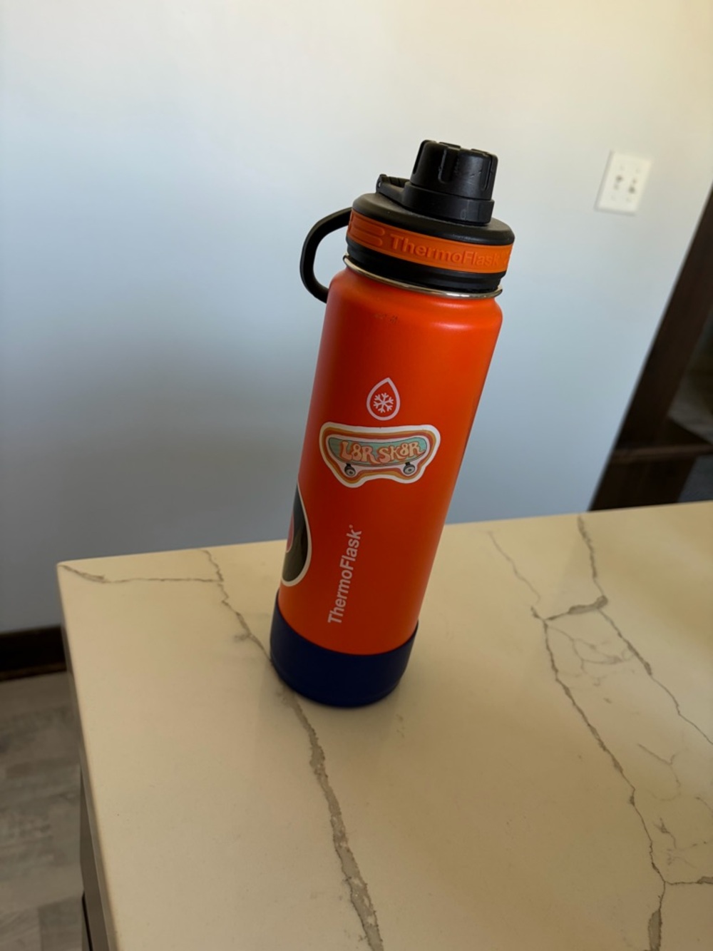 ThermoFlask Orange Stainless Water Bottle with Blue Base